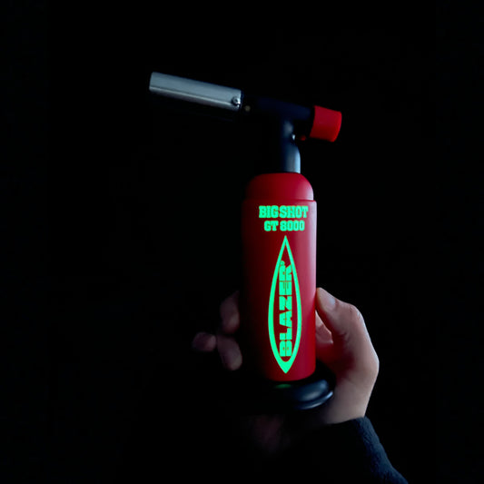 Big Shot Blazer in a dark room after being exposed to sunlight in order to show the glowing lettering.