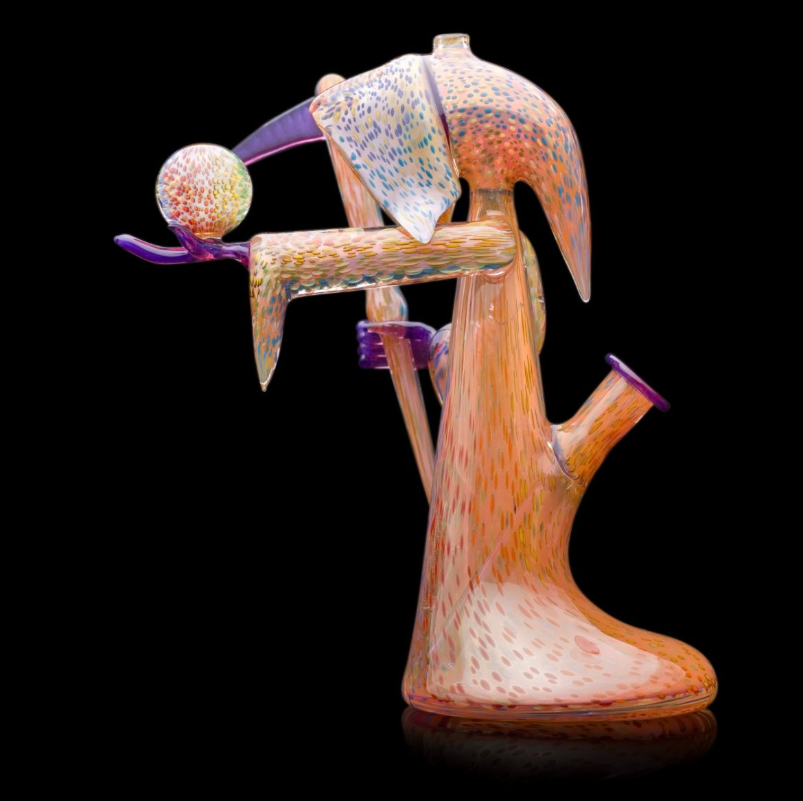 Decorative glass sculpture of a reaper holding a scythe and crystal ball.