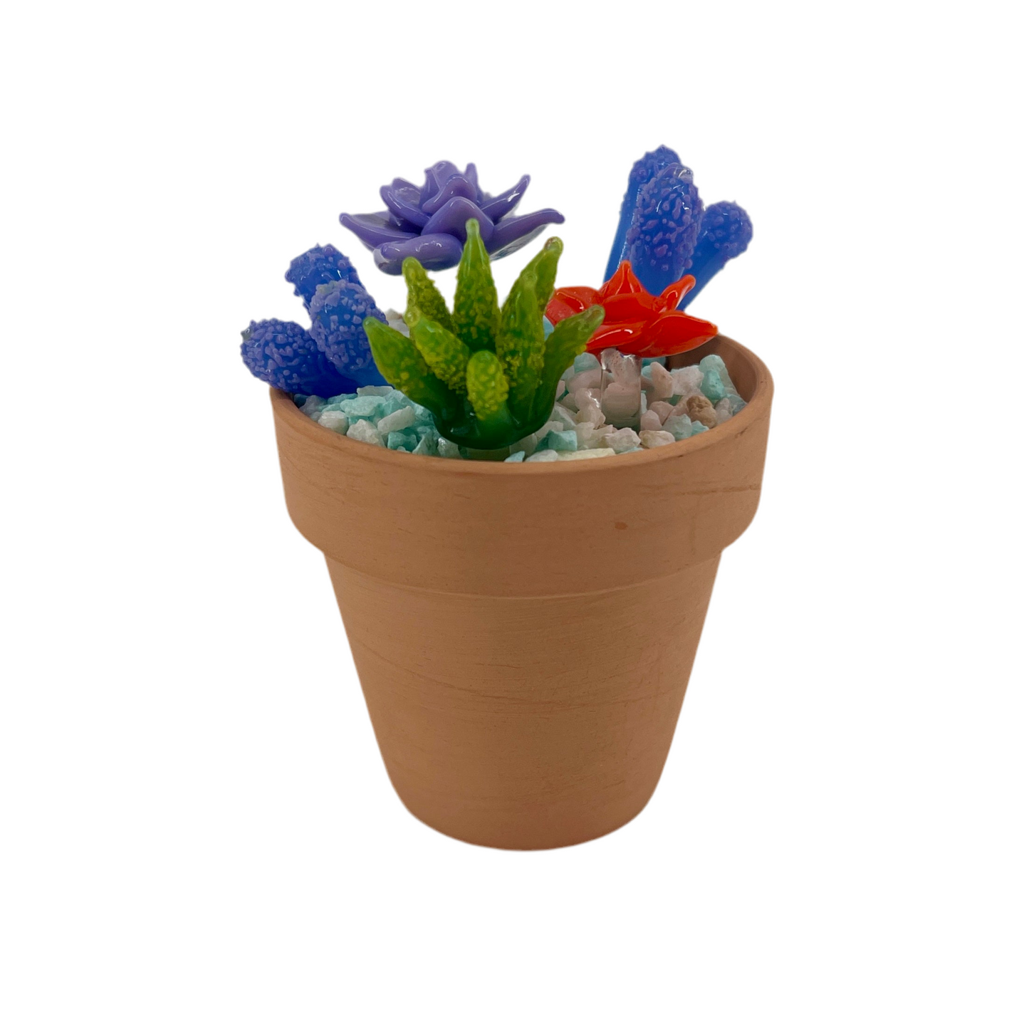 Decorative pot with colorful artificial succulents on a white background.