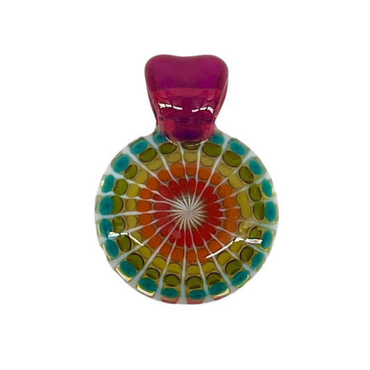 Multicolored circular glass pendant with a royal jelly top on a white background.