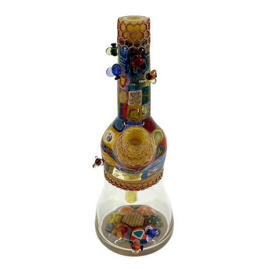Colorful glass pipe with decorative elements on a white background