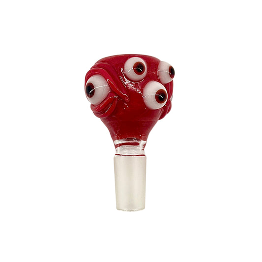 Red glass smoking accessory with multiple eyes on a white background