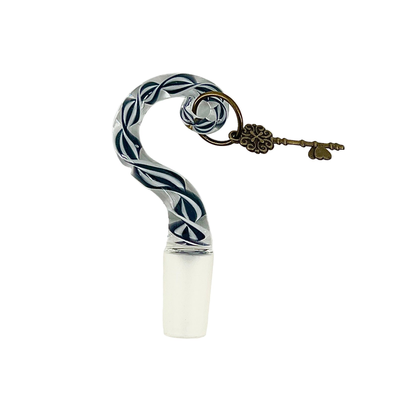 Decorative bottle stopper with twisted design and key charm on a white background