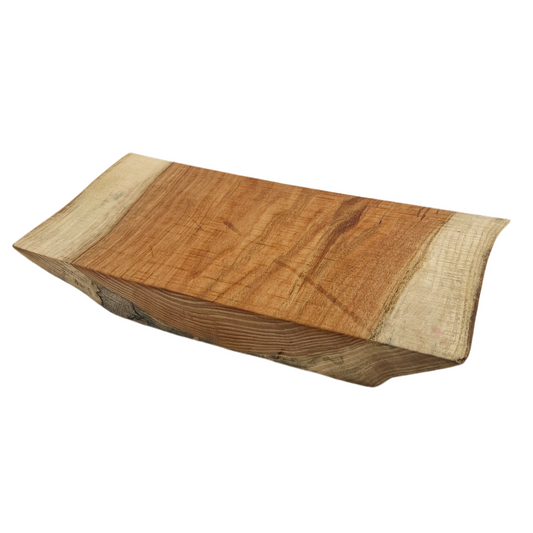 Wooden cutting board with a natural finish on a white background.
