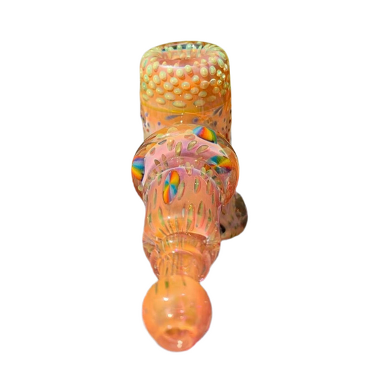 Decorative glass object with multicolored patterns on a white background.