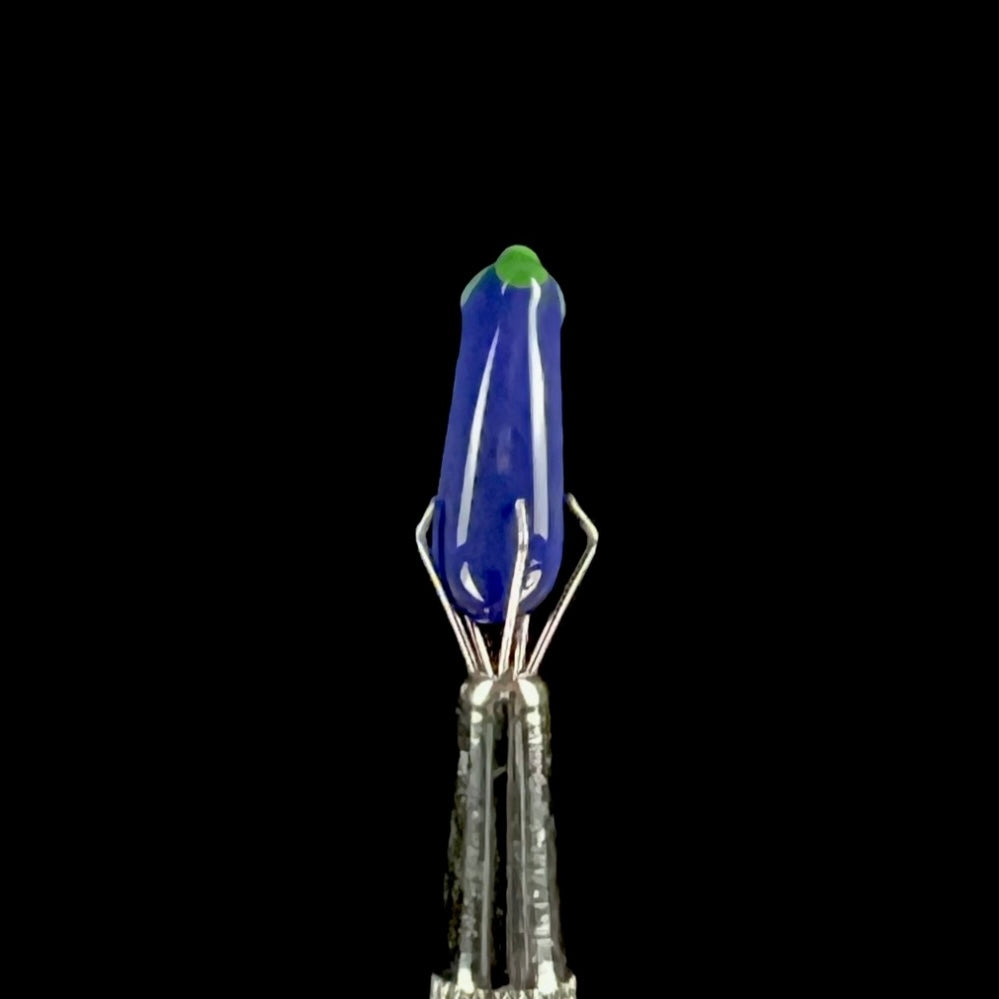 Purple glass eggplant-shaped pillar with green accents.