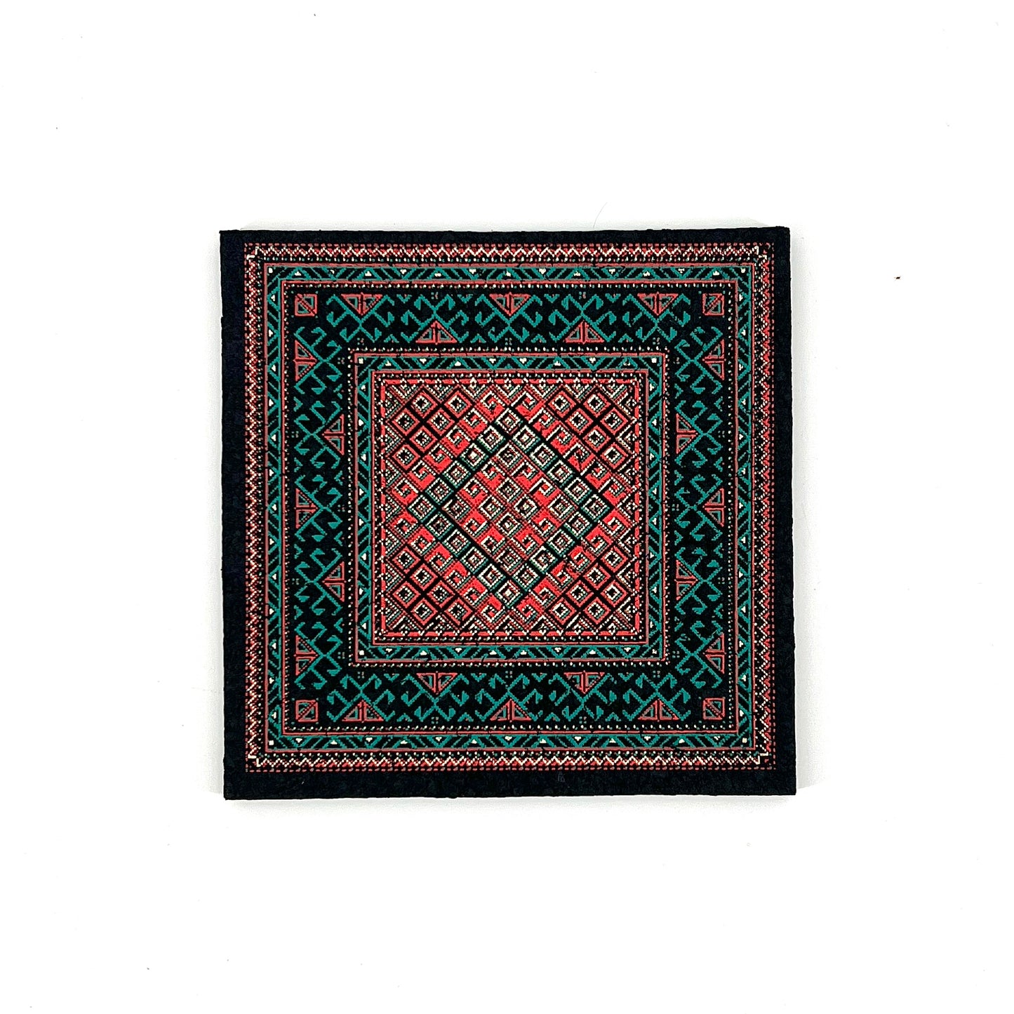 Patterned mat with geometric design on a white background