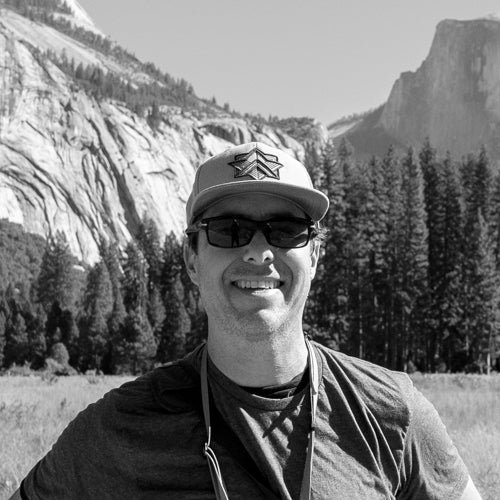 Josh Sable standing in front of mountain scenery/