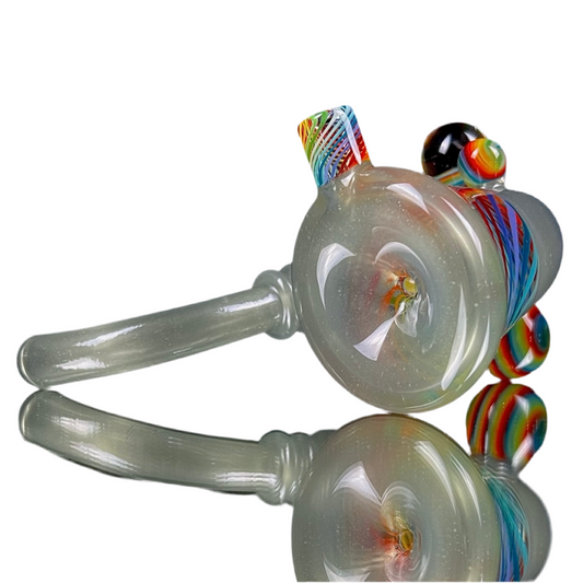A hand-blown glass pipe with pastel rainbow stripes and a unique design, featuring a rounded body, two protruding stems, and a multicolored tip.