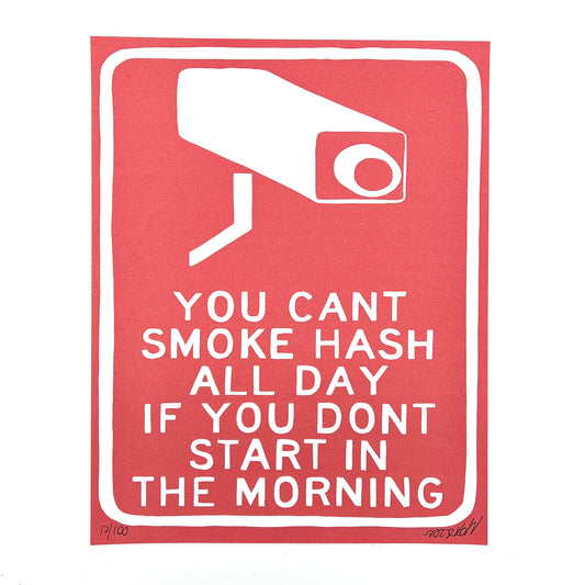 A red print with white text and a graphic of a security camera that says 'YOU CAN'T SMOKE HASH ALL DAY IF YOU DON'T START IN THE MORNING'.