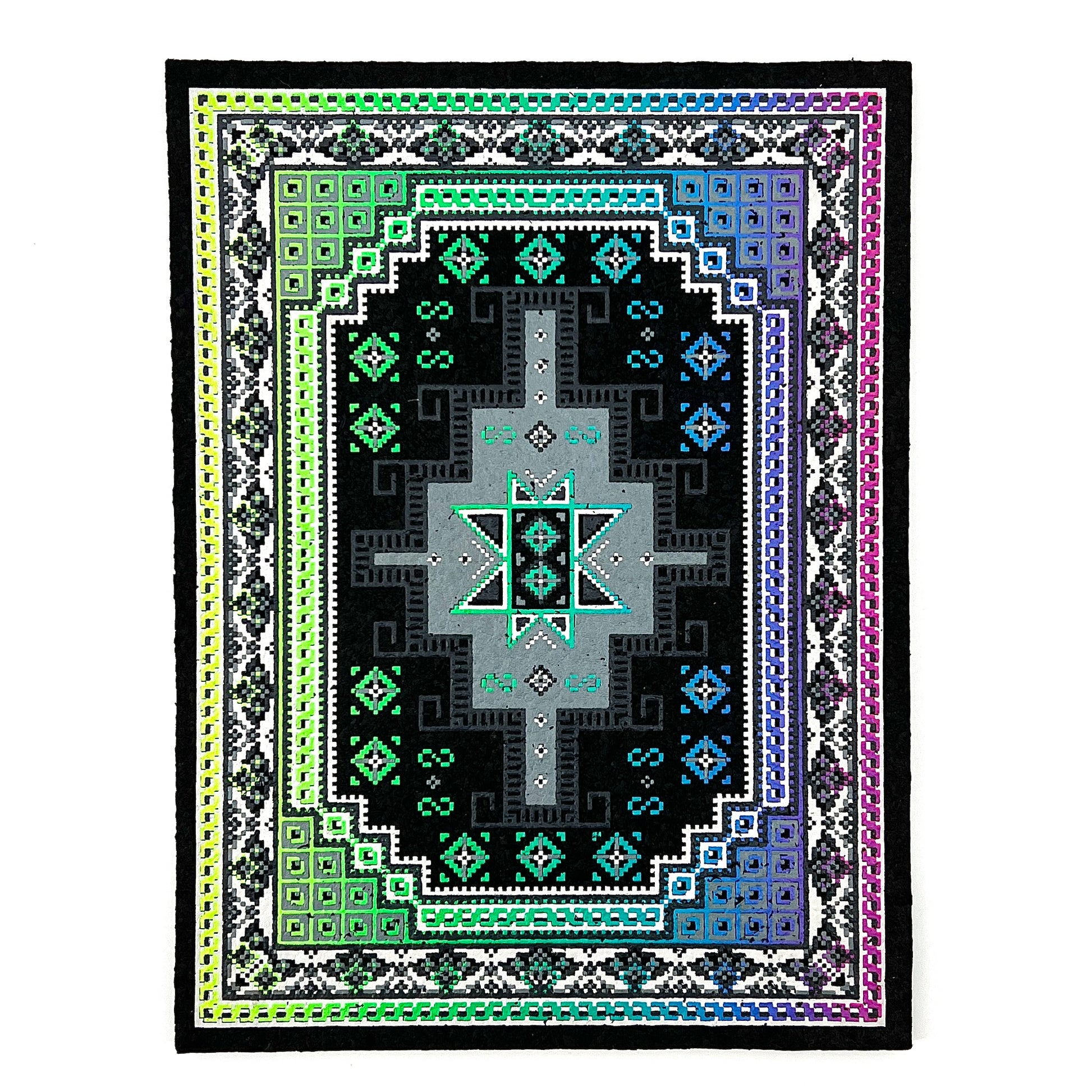 A multicolored geometric-patterned area rug with a central mandala-like design, bordered by a traditional pattern, and finished with a fringed edge.