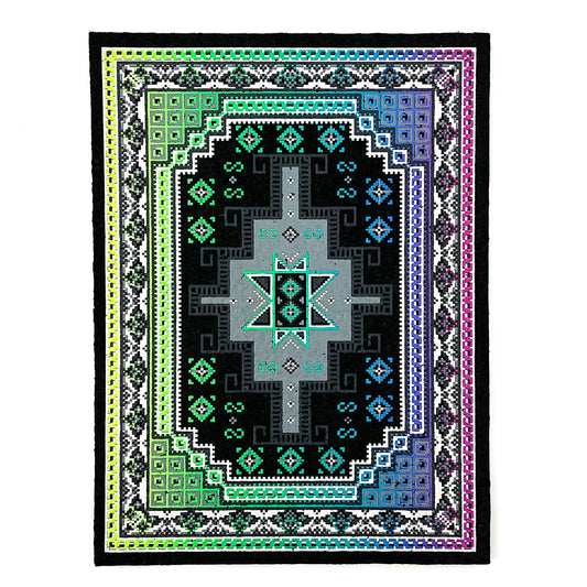 A multicolored geometric-patterned area rug with a central mandala-like design, bordered by a traditional pattern, and finished with a fringed edge.