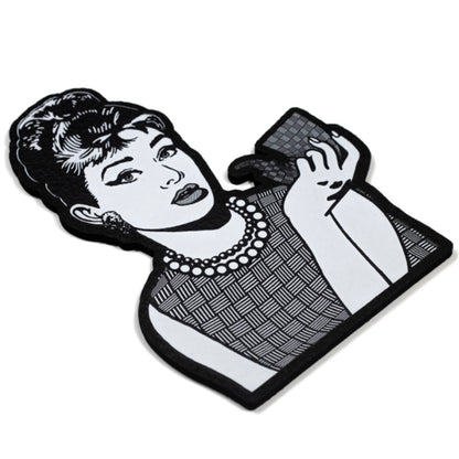 Moodmat depicting Audrey Hepburn with a sherlock, both of them covered in "chip weave," Chris Carlson's signature glass technique. 
