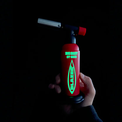 Big Shot Blazer in a dark room after being exposed to sunlight in order to show the glowing lettering.