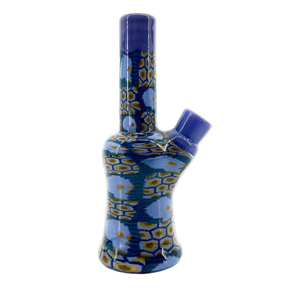 Blue and yellow patterned glass mini tube on a white background.