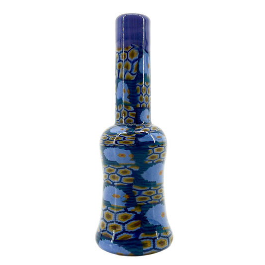 Glass mini tube with blue and yellow pattern on a white background.