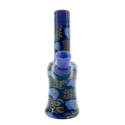 Blue and yellow patterned glass mini tube on a white background.