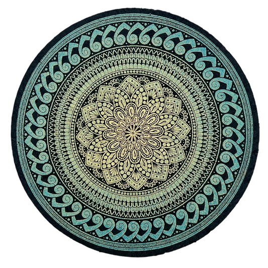 Round mandala mat with green and black design on a white background