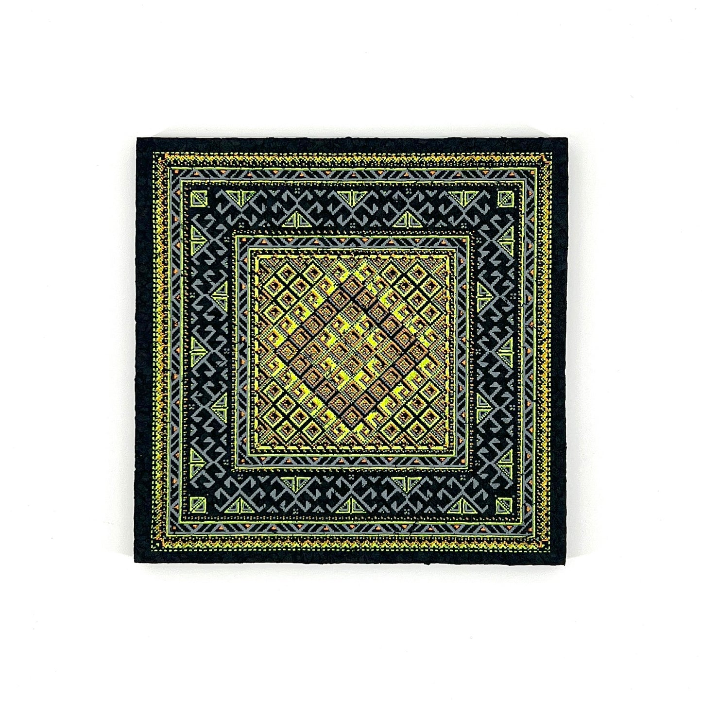 Black mat with yellow geometric pattern on a white background
