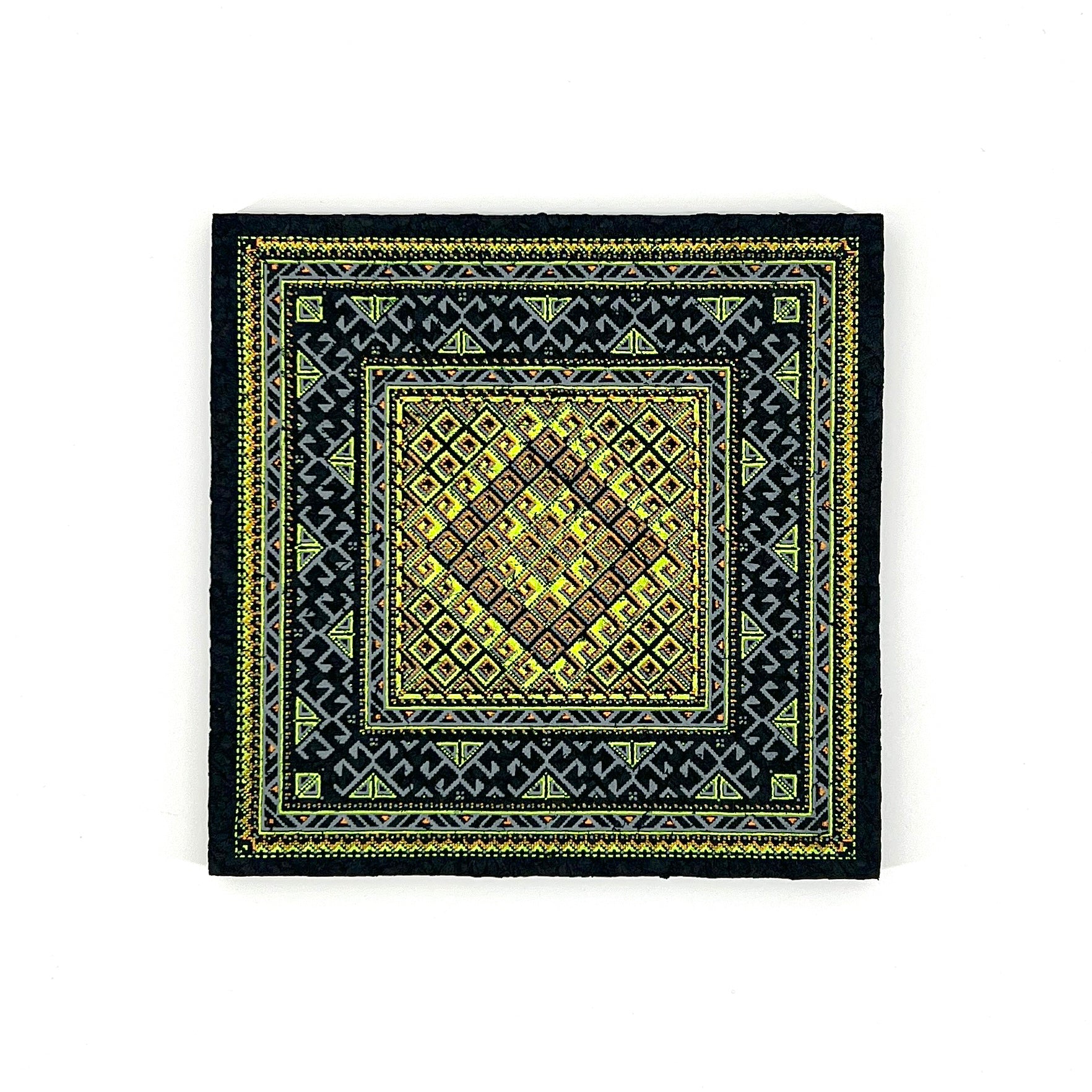 Black mat with yellow geometric pattern on a white background