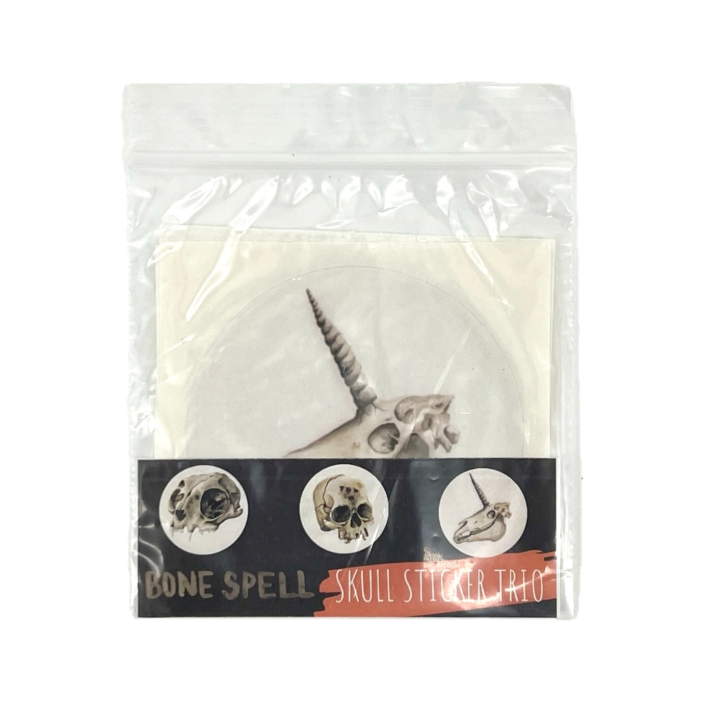 Packaged skull sticker trio with decorative skull designs on a white background.