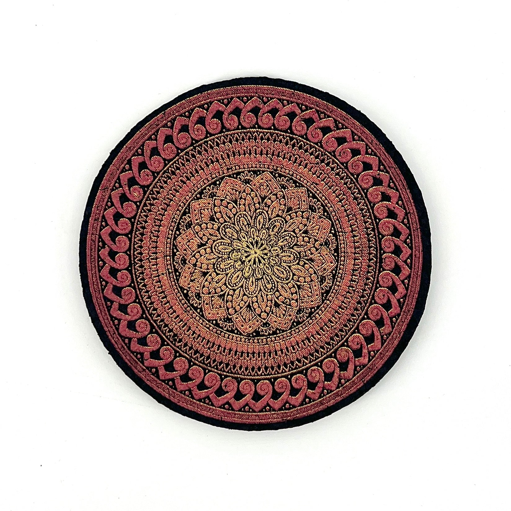 Decorative round mat with intricate patterns on a white background