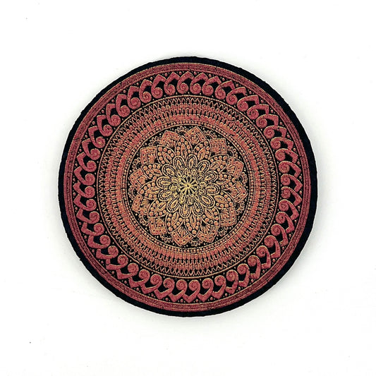 Decorative round mat with intricate patterns on a white background