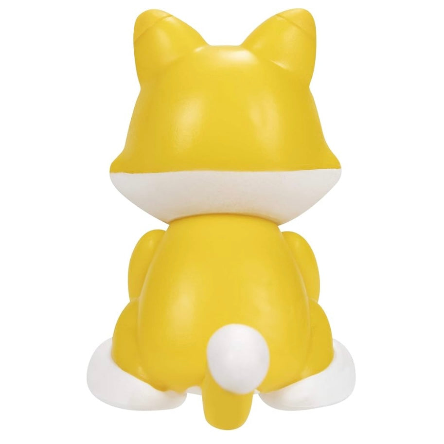 Yellow cat-shaped figure on a white background