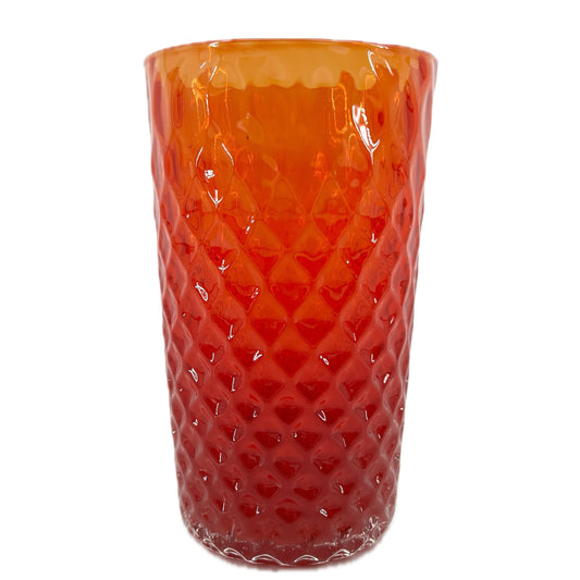 A red glass with a geometric optic pattern.