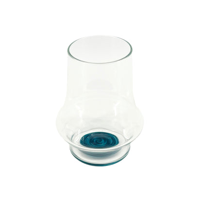 Clear handblown glass cup with a blue wig wag design on the base