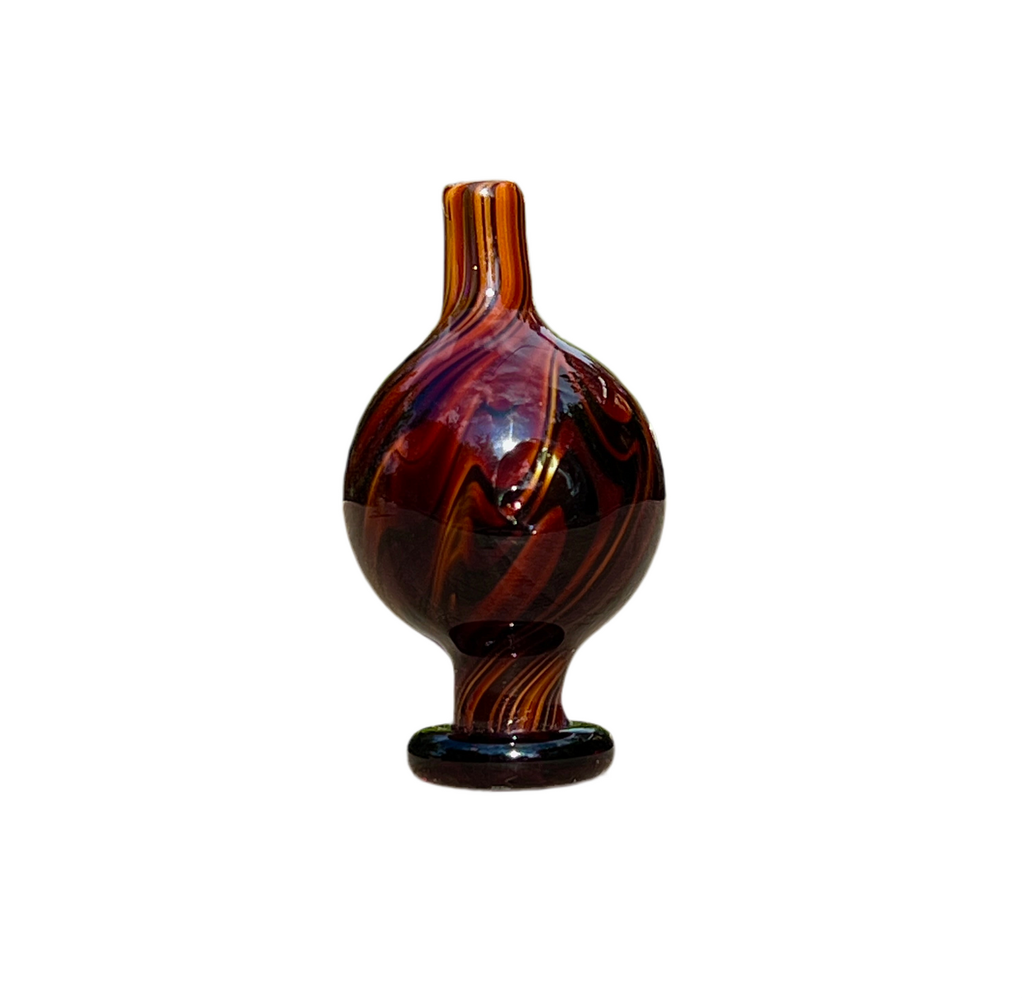 Brown and black patterned cap on a white background.