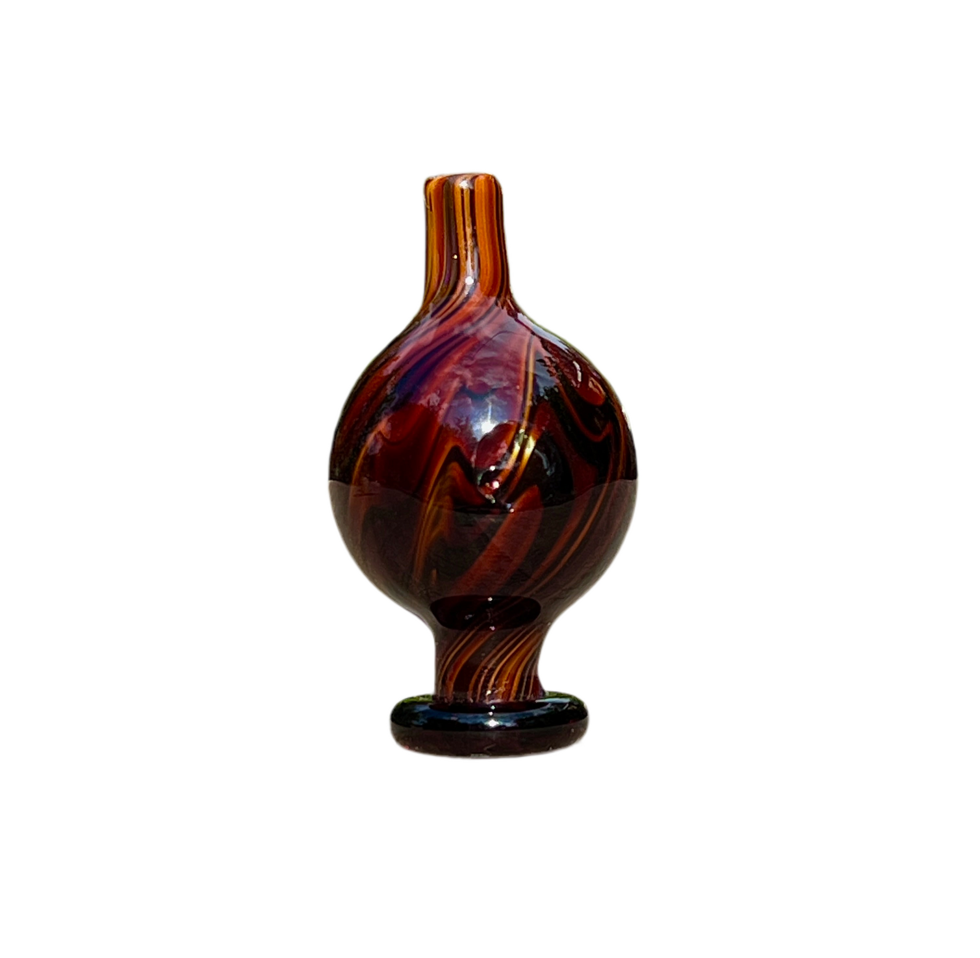 Brown and black patterned cap on a white background.