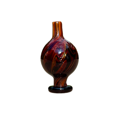 Brown and black patterned cap on a white background.