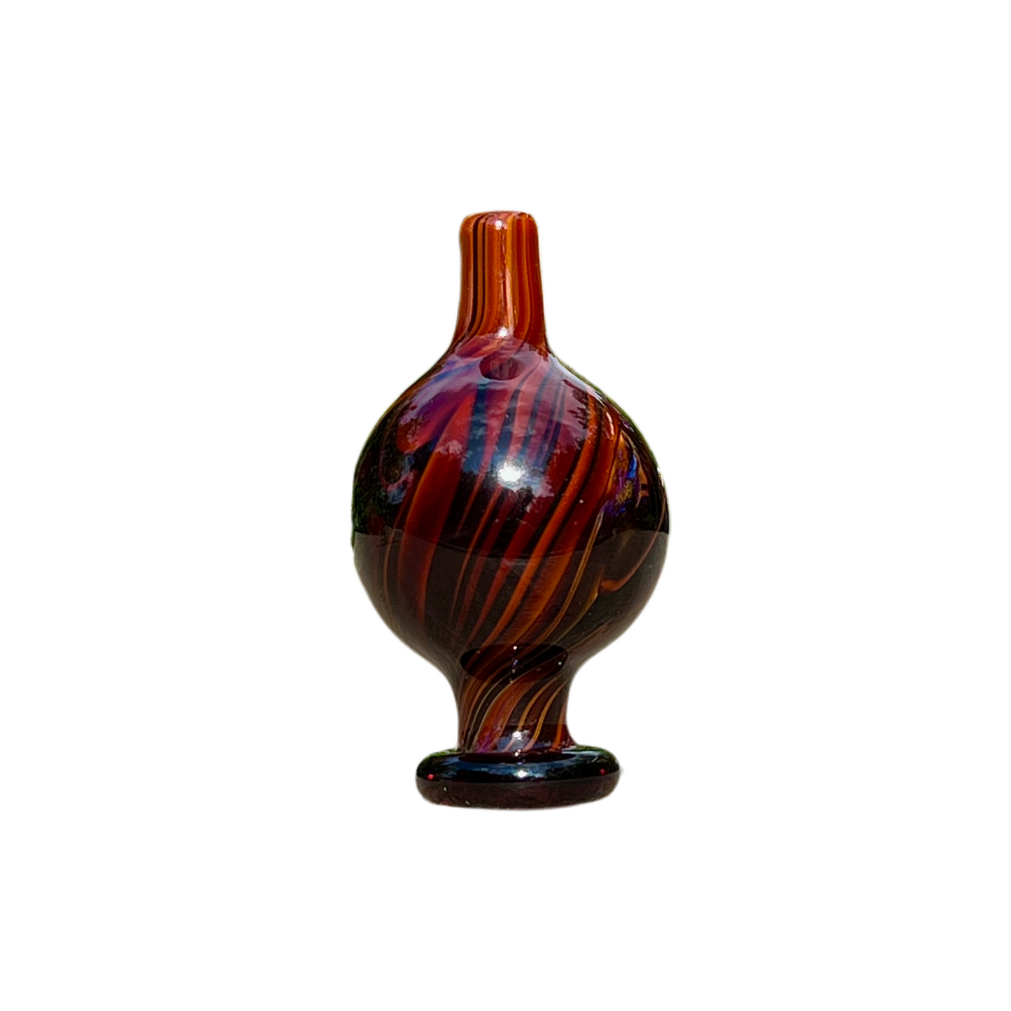 Decorative glass cap with brown and black swirl pattern on a white background