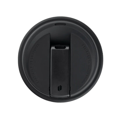 Black circular object with a central slit on a white background.