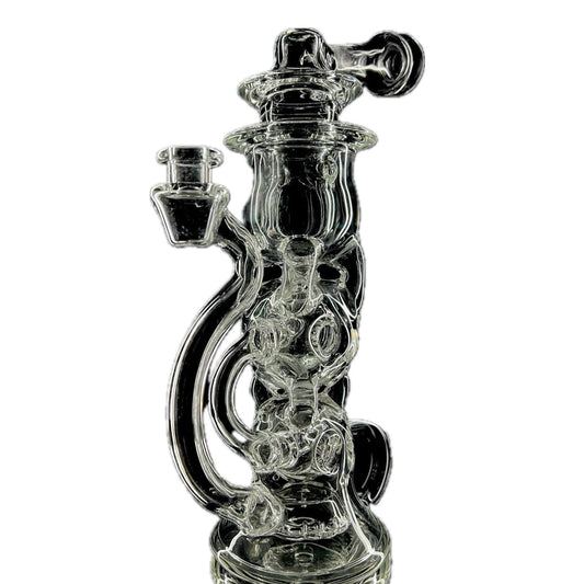 A clear glass recycler with intricate geometric patterns and a 20-hole slit and grid puck perc.
