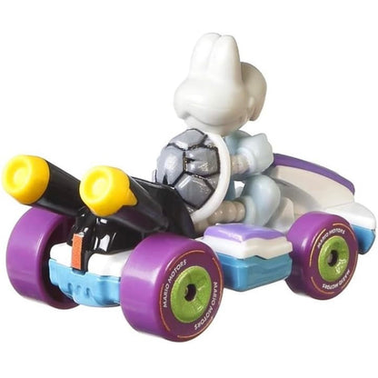 A die-cast toy model of Mario Kart's Dry Bones Standard Kart, predominantly purple with black and yellow details, on a white background.
