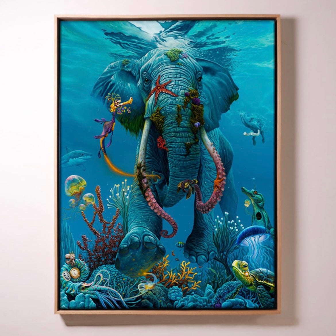 An artistic print depicting a colorful underwater scene with a central elephant figure surrounded by fish and coral.