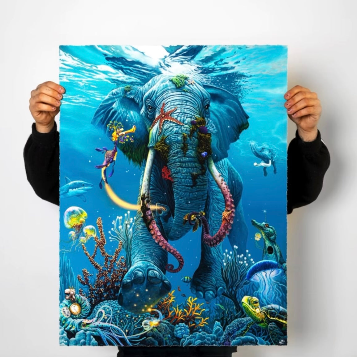 An artistic print depicting a colorful underwater scene with a central elephant figure surrounded by fish and coral.