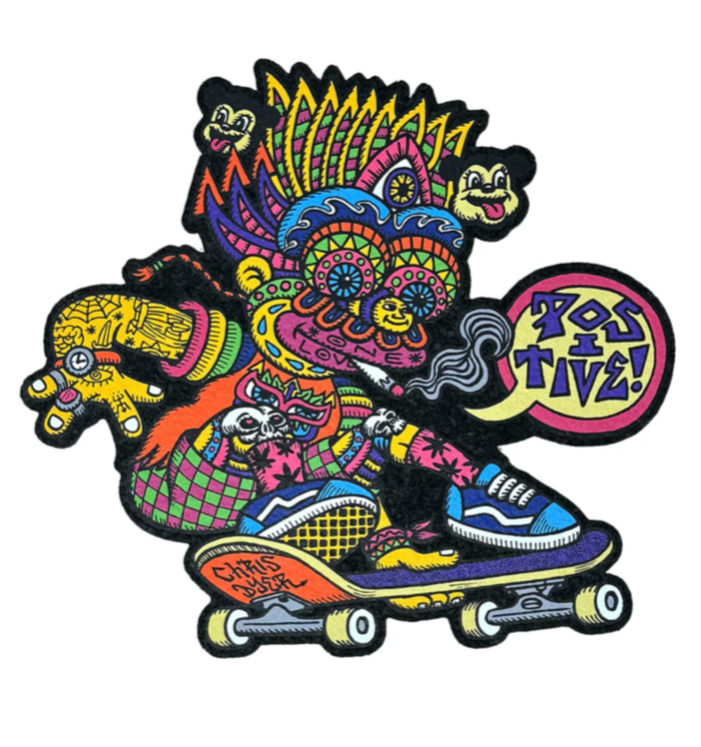 Colorful sticker of a character with a headdress and skateboard on a white background