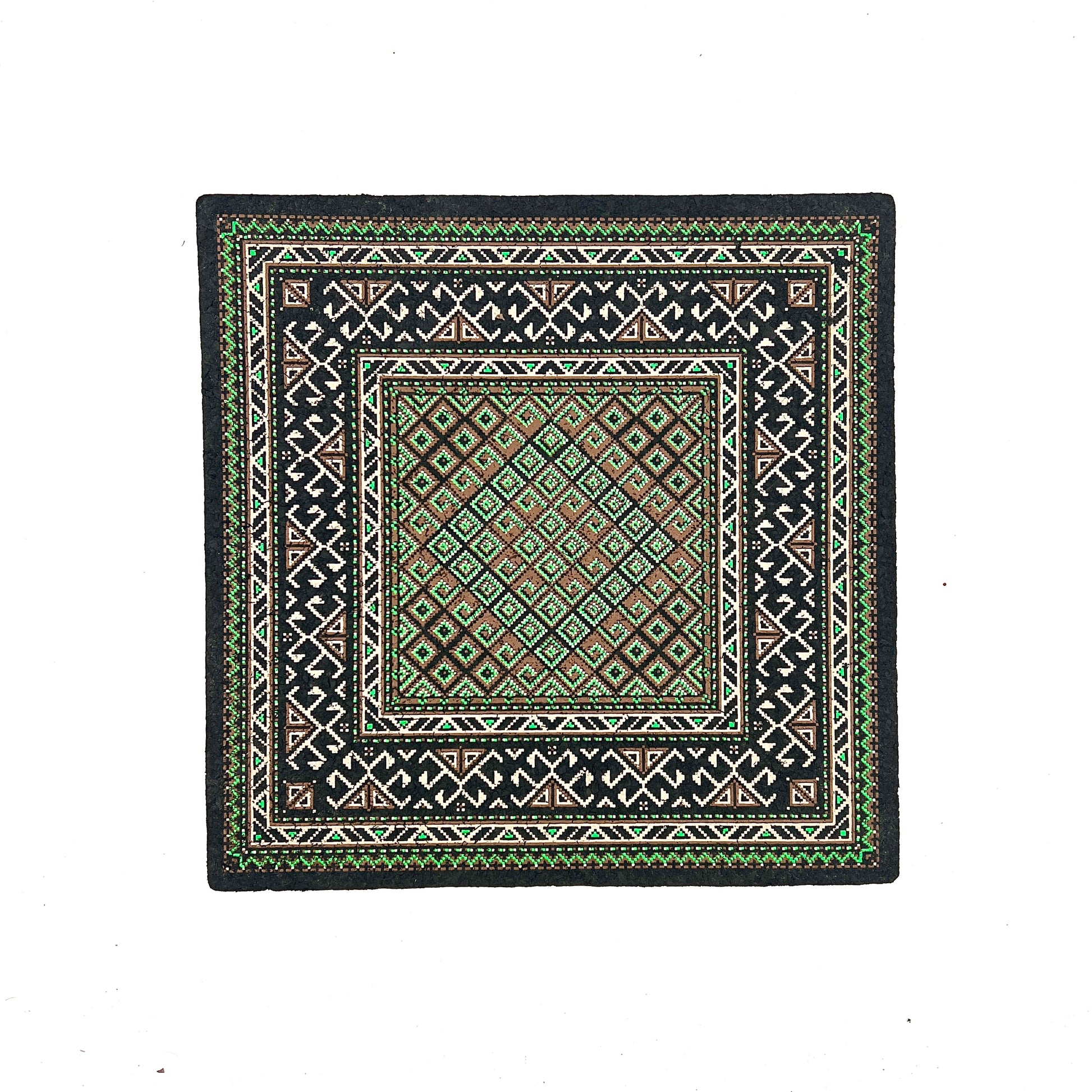 Square mat with geometric pattern on a white background.