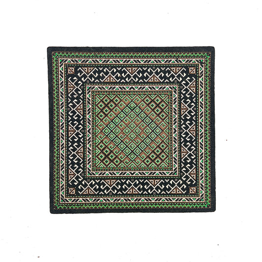 Square mat with geometric pattern on a white background.