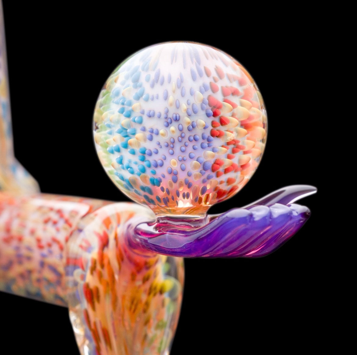 Decorative glass sculpture of a reaper holding a scythe and crystal ball.