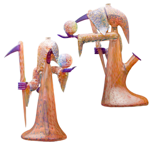 Decorative glass sculpture of a reaper holding a scythe and crystal ball.