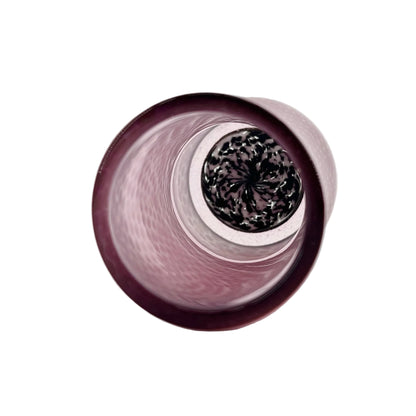 Close-up of a pink cylindrical cup with a patterned surface on a white background.