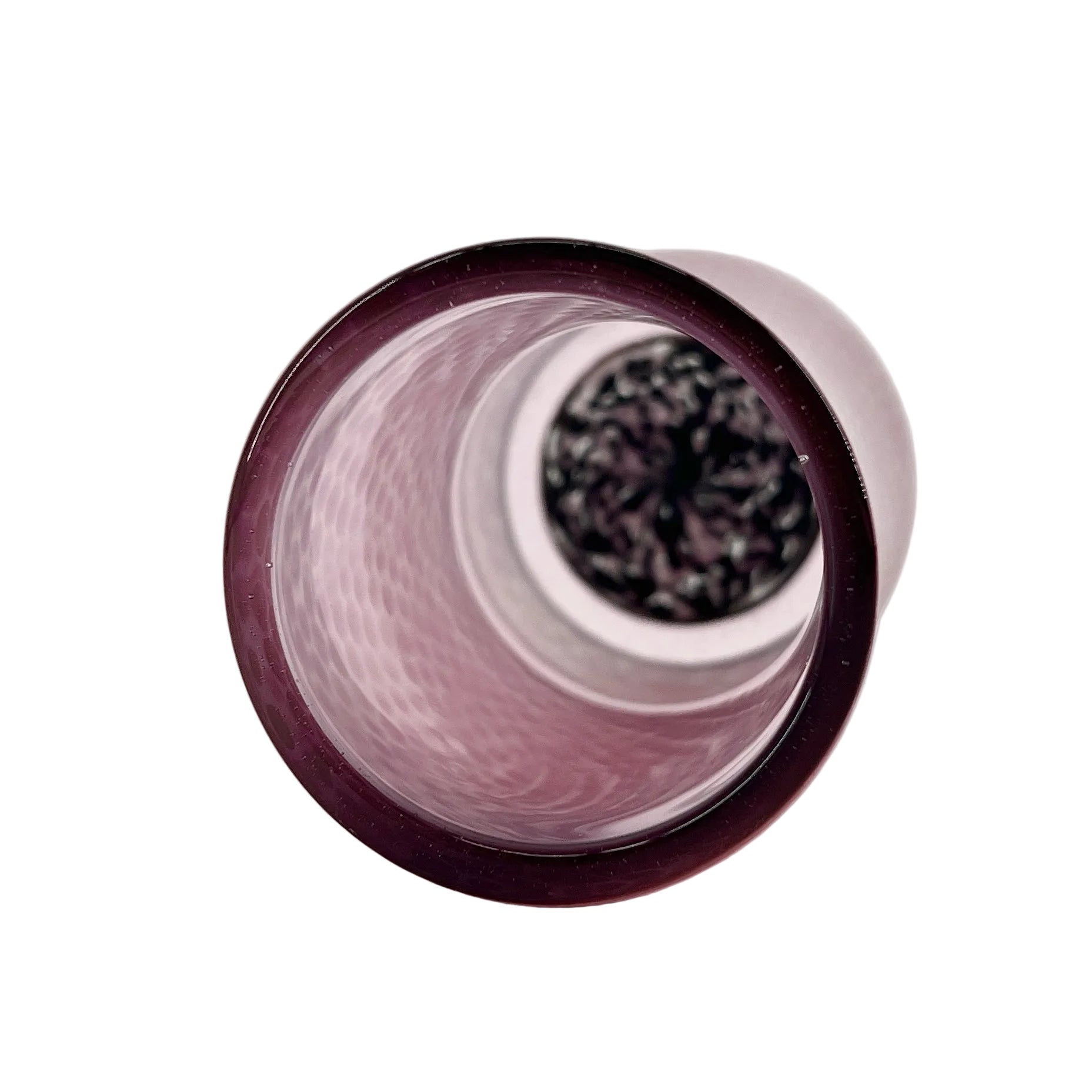 Close-up of a pink glass cup on a white background