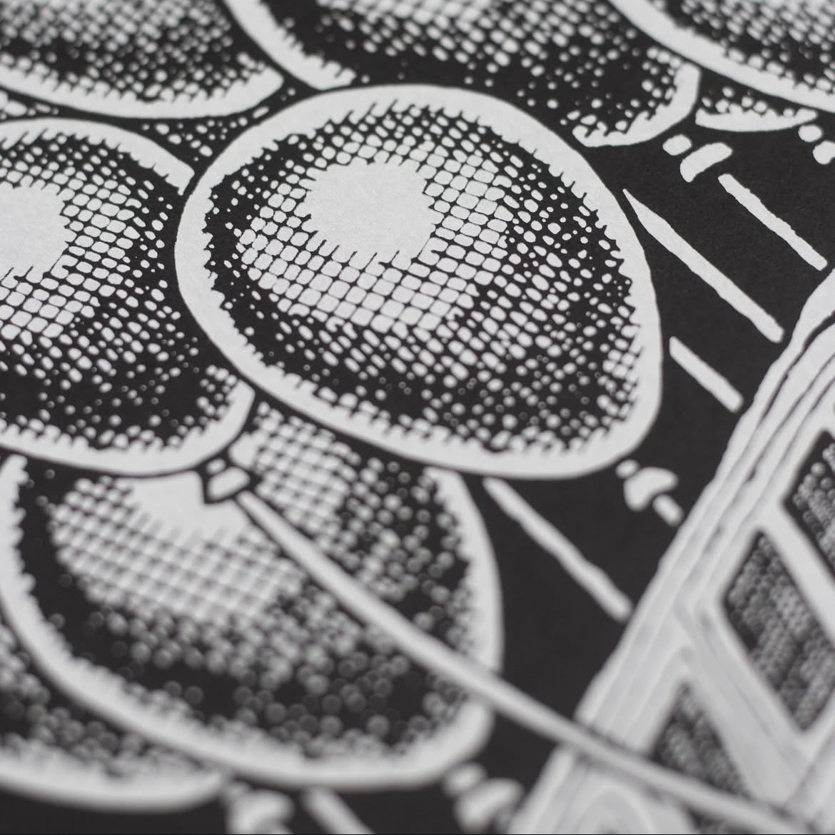 Close-up of a black and white patterned surface with circular designs.