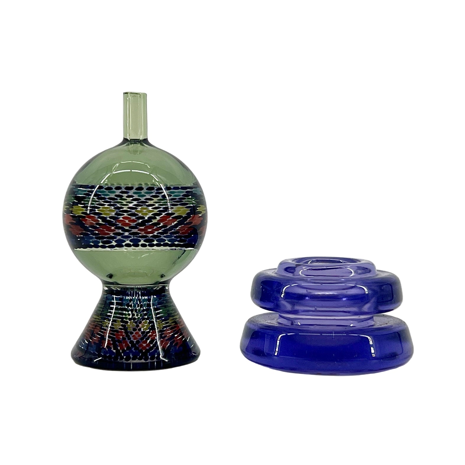 Decorative glass bottle with a colorful pattern and blue lid on a white background