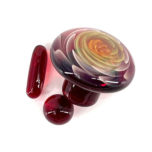 A three-piece glass set including a cap plug, valve marble, and a pillar, with a fume implosion design in red and yellow hues.