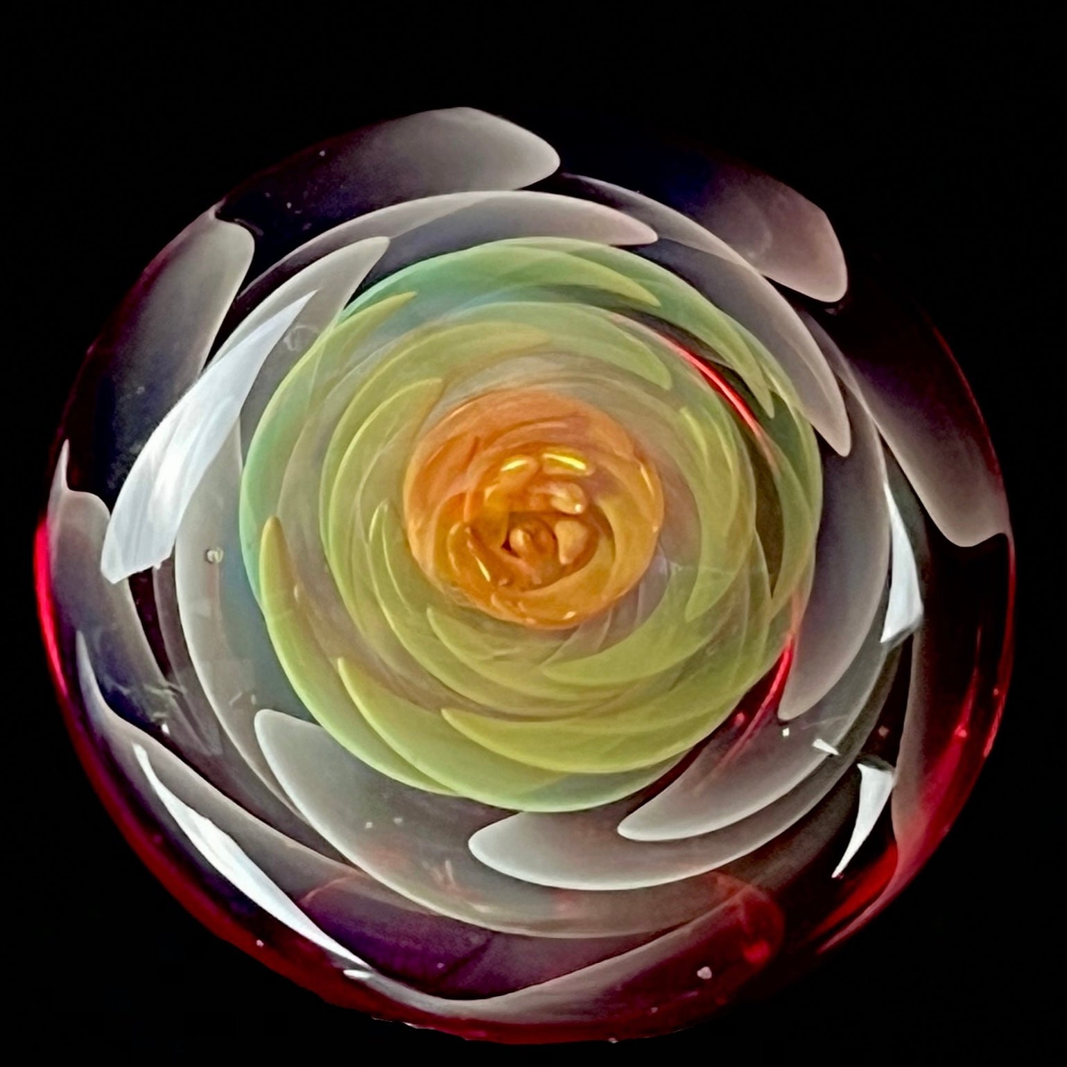 A set of three Phase Glass pieces with a swirling multicolor design, including a cap plug, valve marble, and pillar.